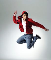 Portrait of an excited young man jumping in air