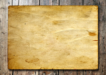 Old paper over an old wood background