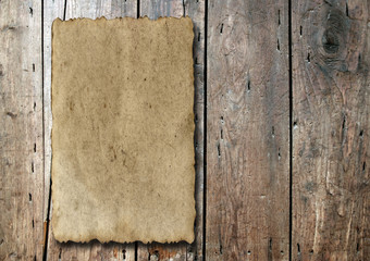 Old paper over an old wood background