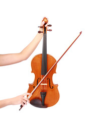 vintage violin and fiddle stick in woman hands over white