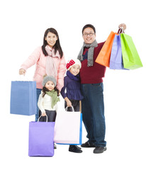 happy asian family with shopping bag in winter clothing