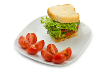 Tomatoes and cucumbers on white