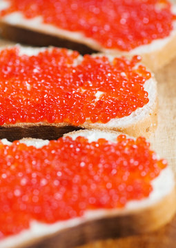 Red caviar on a slice of bread