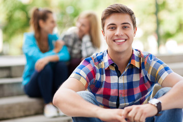 Young man with friends in background