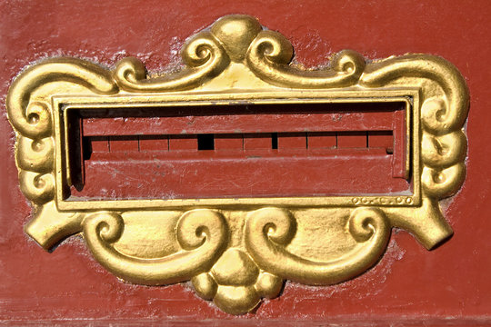 Mailslot on old red post box