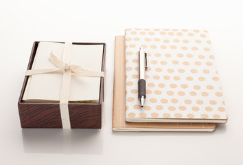 Notebooks with a box of cards