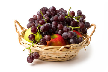 Delicious sweet fruit in basket on white background