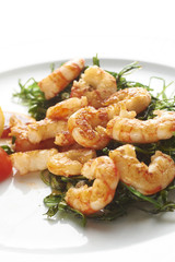 Fried prawns with fried vegetable on white plate