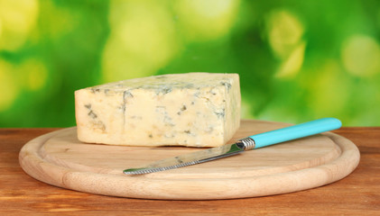 Cheese with mold and knife