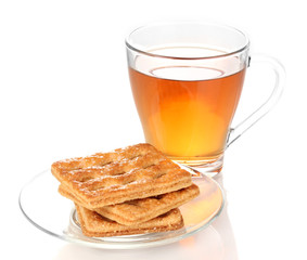Cup of tea and cookies isolated on white