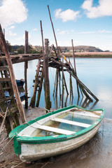 Boat aground and a pier