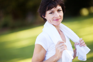 elegant middle aged woman relaxing after workout