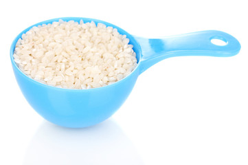 Measuring spoon with grain isolated on white