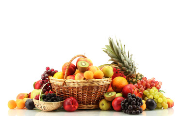 Assortment of exotic fruits and berries in baskets isolated