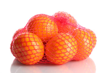 ripe tangerines in bag isolated on white