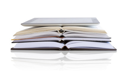 Tablet pc on open  books