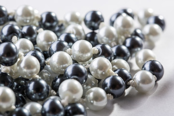 String of black and white pearls