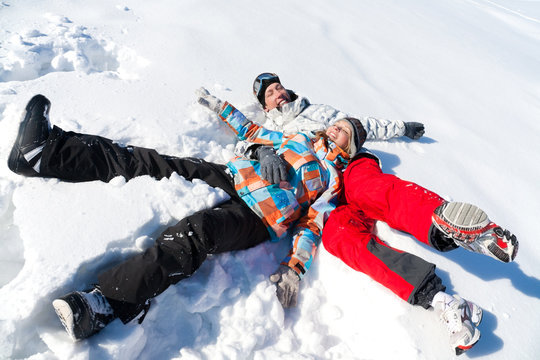 Couple play  in snow