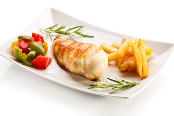 Grilled chicken breast, French fries and vegetables