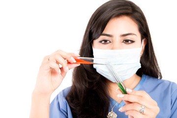 laboratory assistant analyzing a test tubes