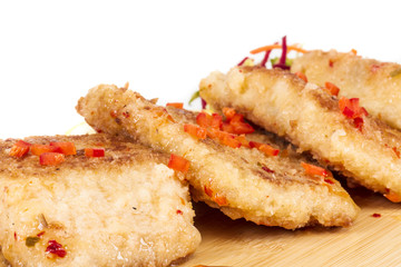 Fried fish fillets with  salad.