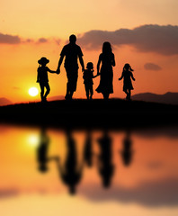 happy family at sunset