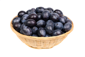 fresh blue plums in Fruit Basket on the white background