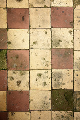 Grunge background of cracked tiles