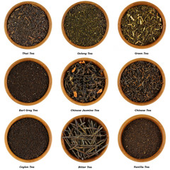 Set of Dried Tea Leaves in Wooden Bowls, isolated on white