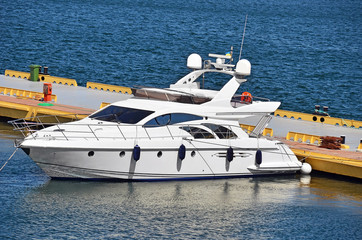 Fototapeta premium White motor yacht over harbor pier, Odessa, Ukraine