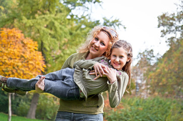 Fototapeta premium Happy family relaxing outdoors In park