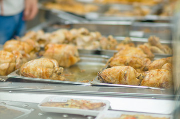 Fried grill chicken wings and legs on table in supermarket