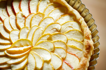 Apple tart detail with apple slices fanned in a pattern - 45339897