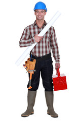 craftsman holding a blueprint and a toolbox