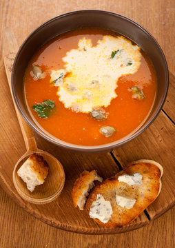 Pumpkin soup with cream, cheese and croutons