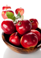 Red apples in a wooden bowl