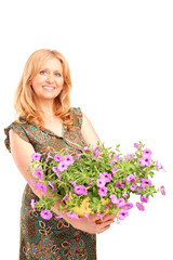 A mature female holding flowers