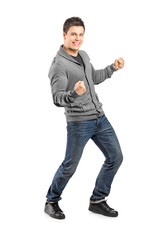 Naklejka premium Full length portrait of a young male gesturing happiness