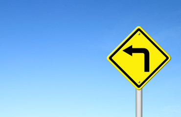 Road Sign - Left Turn Warning with blue sky