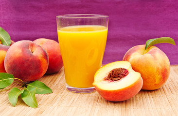 glass of juice with peaches