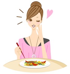 おいしい料理を食べる女性