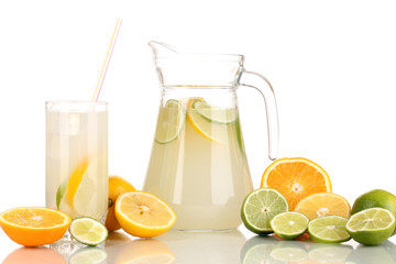 Fototapeta premium Citrus lemonade in pitcher and glass of citrus around isolated