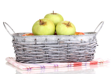 Ripe apples in basket isolated on white