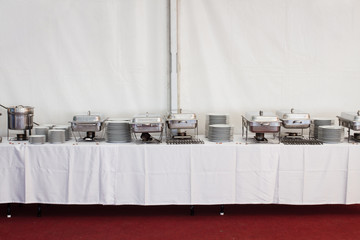 metal kitchen equipments on the table for fine wedding
