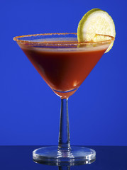 Bloody Mary Cocktail on blue background.
