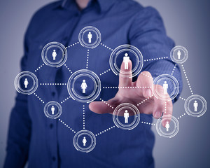 Businessman pressing social media icon
