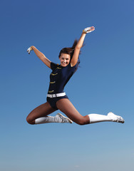 Young female dancer against white background