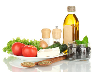 Ingredients for a Greek salad isolated on white background