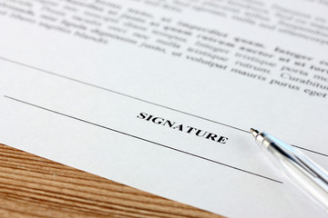 Naklejka premium document on the wooden table close-up