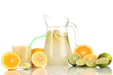 Citrus lemonade in pitcher and glass of citrus around isolated